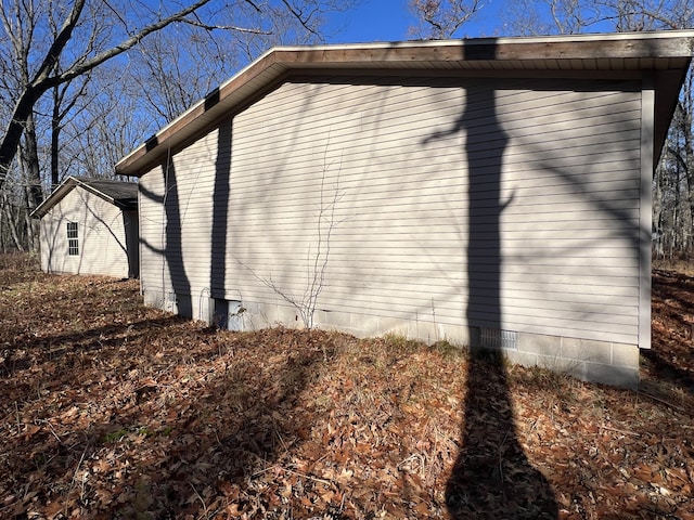 view of property exterior with crawl space