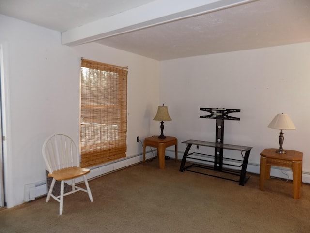 sitting room featuring beamed ceiling and carpet floors