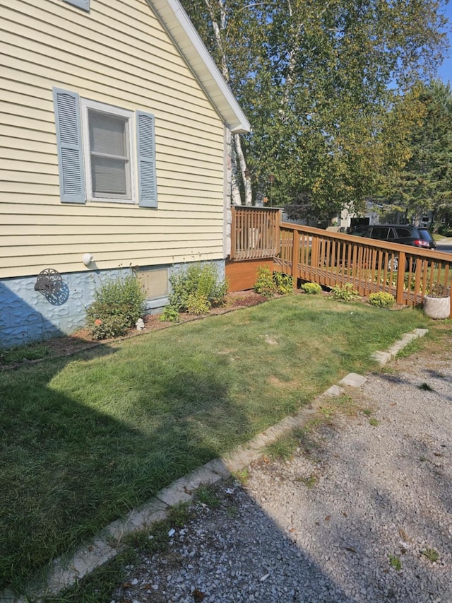 view of yard featuring a wooden deck