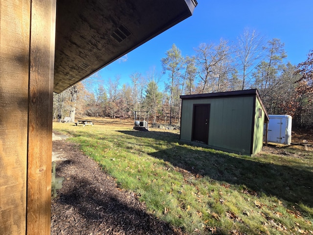 view of yard with an outbuilding and a storage shed