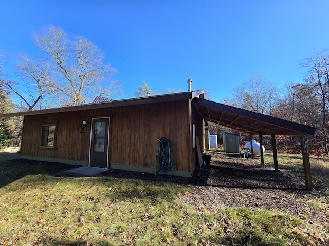 rear view of house with a yard