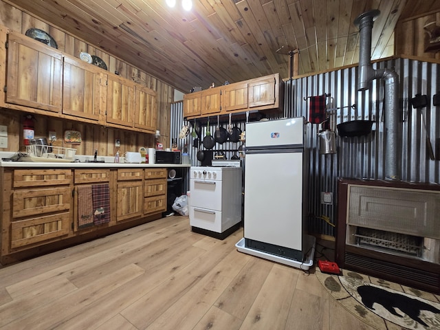 kitchen with brown cabinets, light wood-style flooring, white appliances, wooden ceiling, and light countertops