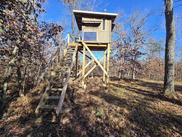 view of home's community featuring stairs