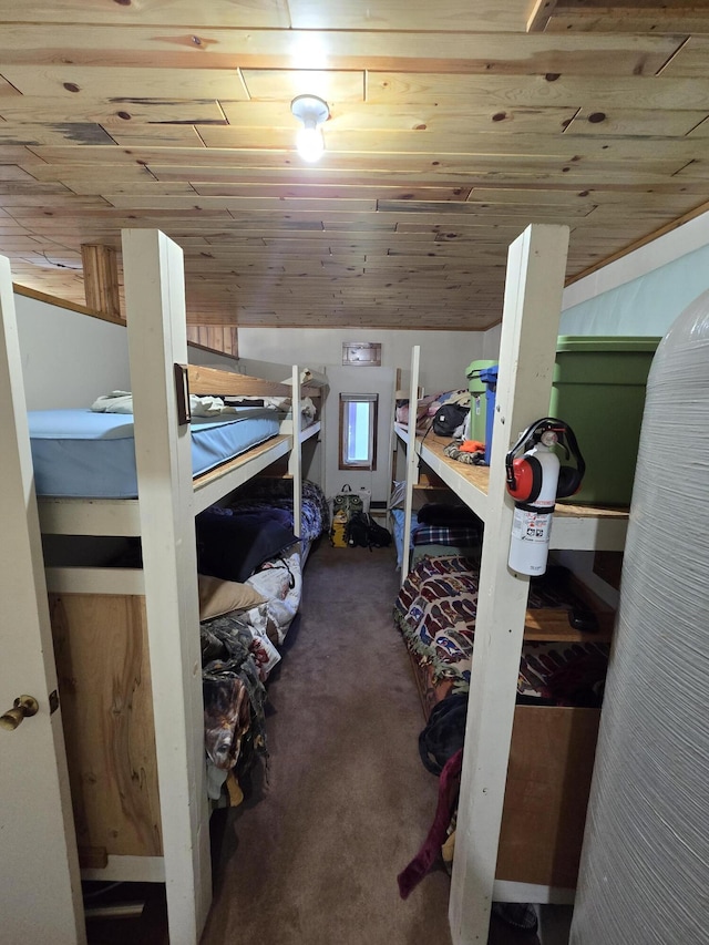 carpeted bedroom featuring wooden ceiling