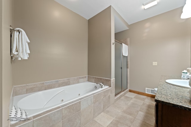 full bathroom with visible vents, baseboards, a whirlpool tub, a stall shower, and vanity