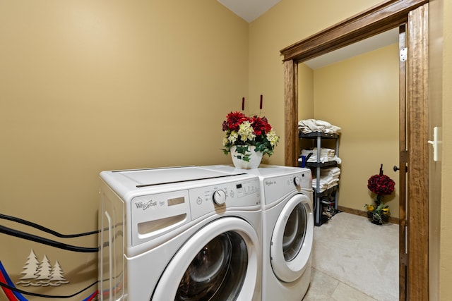 laundry room featuring laundry area, separate washer and dryer, baseboards, and light carpet