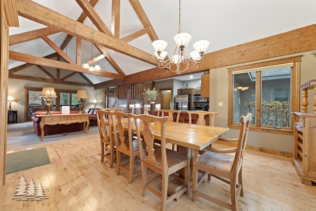 dining room with lofted ceiling with beams, light wood-style floors, and an inviting chandelier