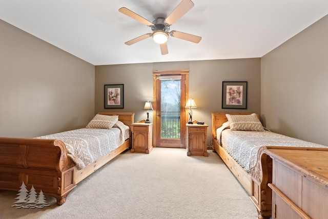 bedroom featuring light colored carpet and ceiling fan