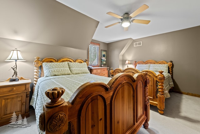 bedroom featuring a ceiling fan, light colored carpet, visible vents, and baseboards