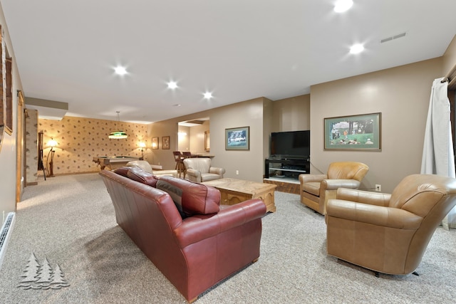 carpeted living room featuring visible vents, recessed lighting, wallpapered walls, baseboards, and indoor bar