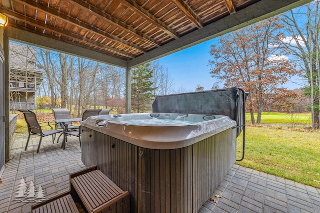 view of patio / terrace with a hot tub