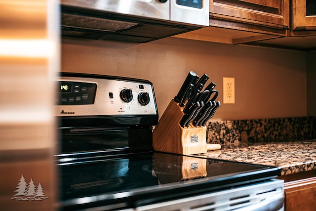 kitchen with stainless steel range with electric cooktop