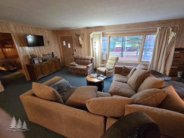 living area with wooden walls and carpet flooring