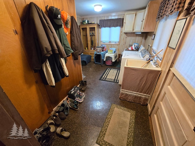 washroom with washer and dryer and cabinet space