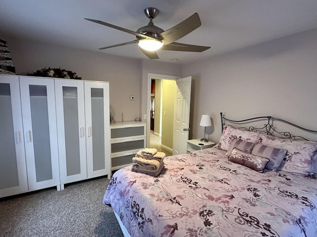 carpeted bedroom with a ceiling fan
