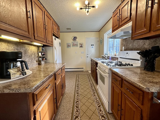 kitchen featuring under cabinet range hood, a baseboard radiator, white appliances, and brown cabinets