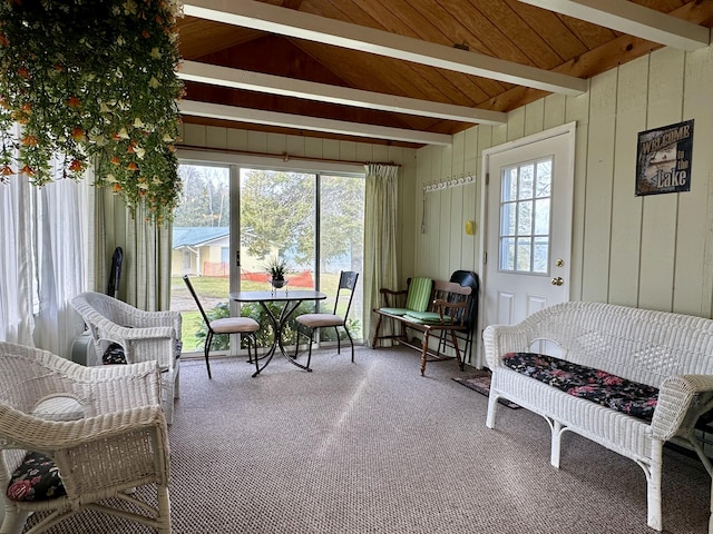 dining area with wooden ceiling, vaulted ceiling with beams, carpet, and a wealth of natural light