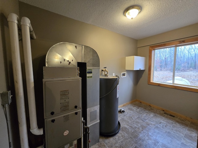 utilities featuring visible vents and water heater