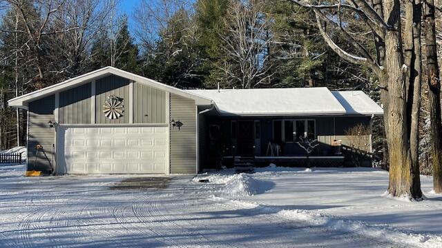 view of snow covered garage