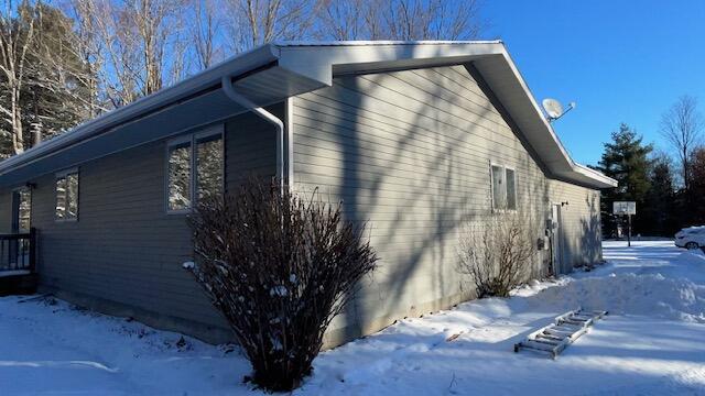 view of snow covered property