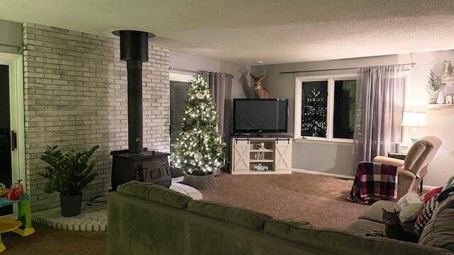 carpeted living area with a wood stove