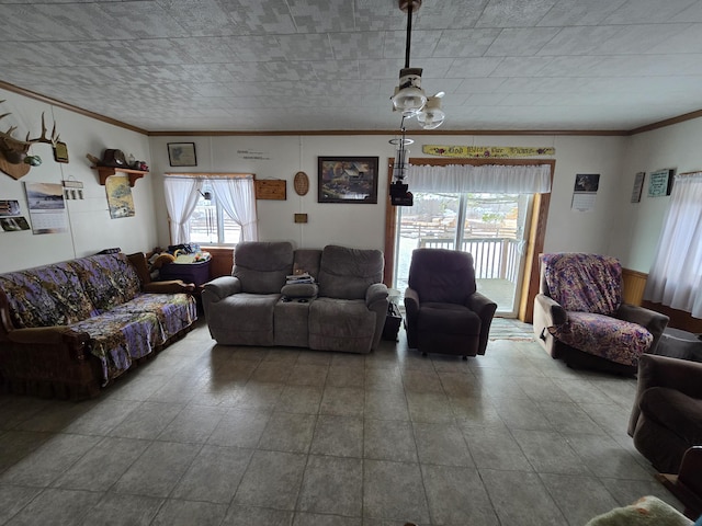 living area with a healthy amount of sunlight and ornamental molding