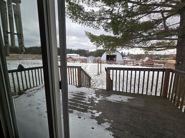 view of snow covered deck