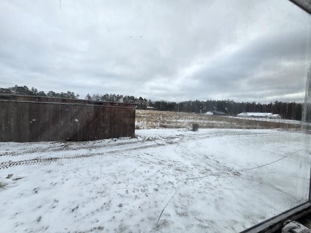 view of yard layered in snow