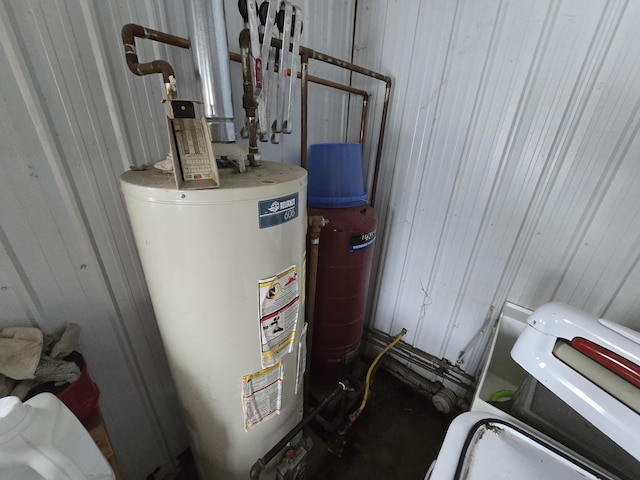 utility room featuring gas water heater