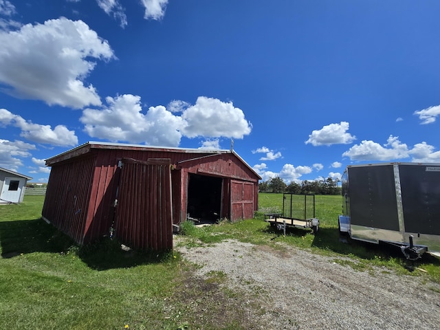 440 N Galbraith Rd, Mio, MI 48647 - view of pole building featuring a lawn