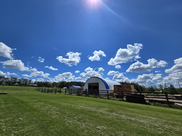 440 N Galbraith Rd, Mio, MI 48647 - view of yard featuring a pole building, an outbuilding, a view of rural / pastoral area, and a detached garage