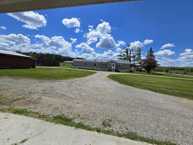 440 N Galbraith Rd, Mio, MI 48647 - view of front facade featuring a front lawn and driveway