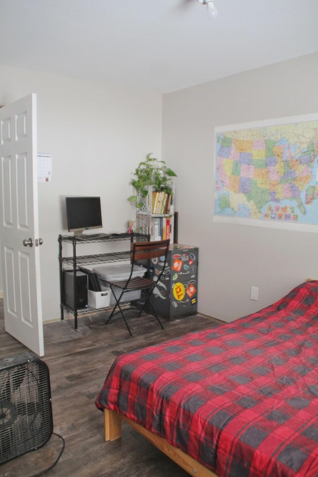 bedroom with wood finished floors