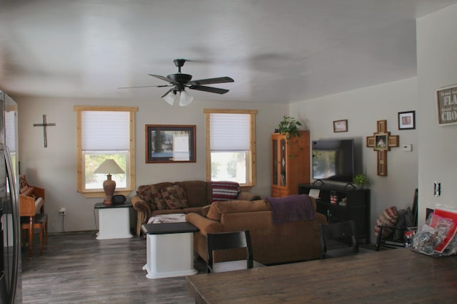 living room with ceiling fan and dark wood-style floors