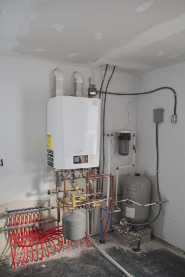 utility room featuring water heater