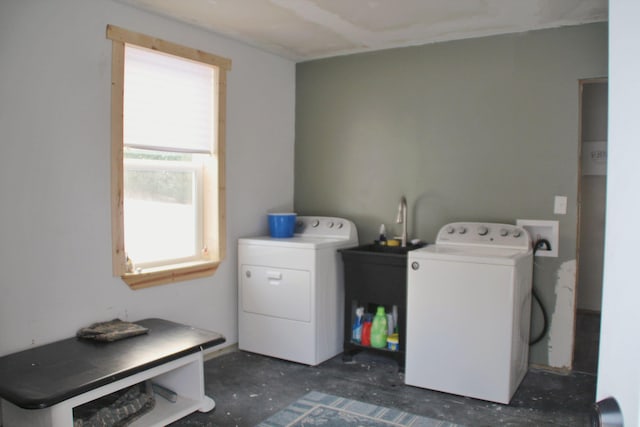 laundry area featuring washing machine and clothes dryer and laundry area