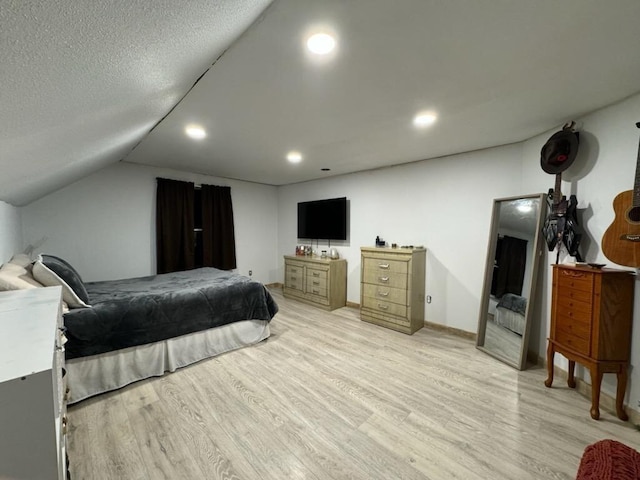 bedroom with baseboards, vaulted ceiling, recessed lighting, light wood-style flooring, and a textured ceiling