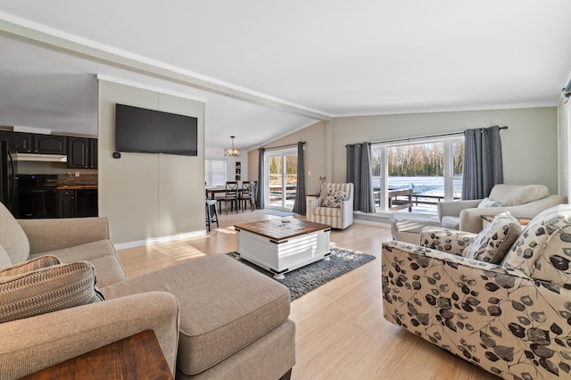 living room featuring light wood-type flooring and lofted ceiling