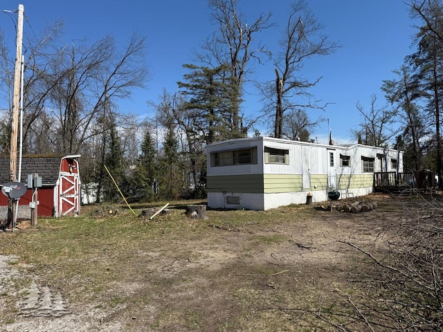 view of property exterior with an outbuilding and a barn
