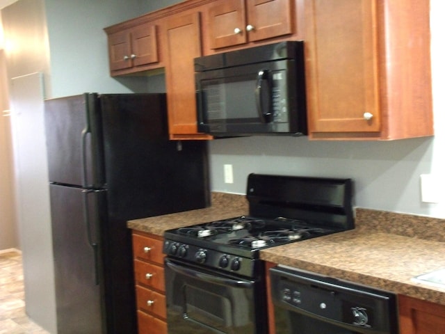 kitchen with black appliances and brown cabinets