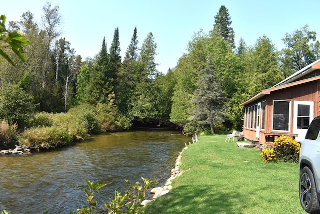 view of water feature with a forest view