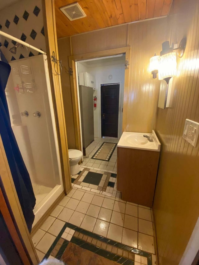 full bath featuring tile patterned floors, visible vents, wooden ceiling, a shower stall, and vanity