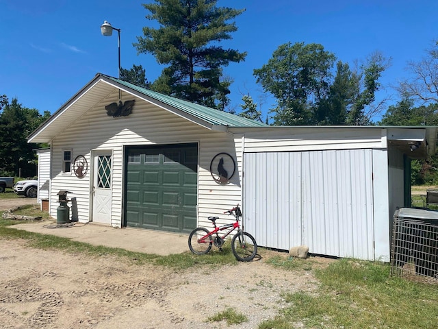 exterior space with central AC and driveway