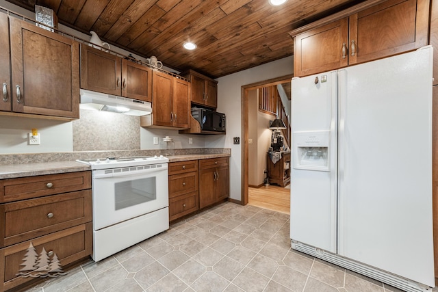 kitchen with white appliances, recessed lighting, light countertops, under cabinet range hood, and wooden ceiling