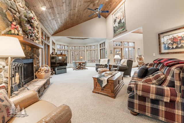 carpeted living room featuring a fireplace, a ceiling fan, wood ceiling, and high vaulted ceiling