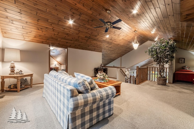 carpeted living room featuring wood ceiling and vaulted ceiling