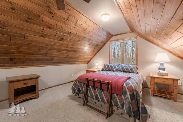 bedroom featuring baseboards, wood ceiling, lofted ceiling, and carpet