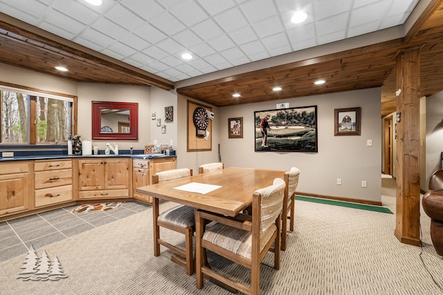 dining room featuring recessed lighting, light colored carpet, a paneled ceiling, and baseboards