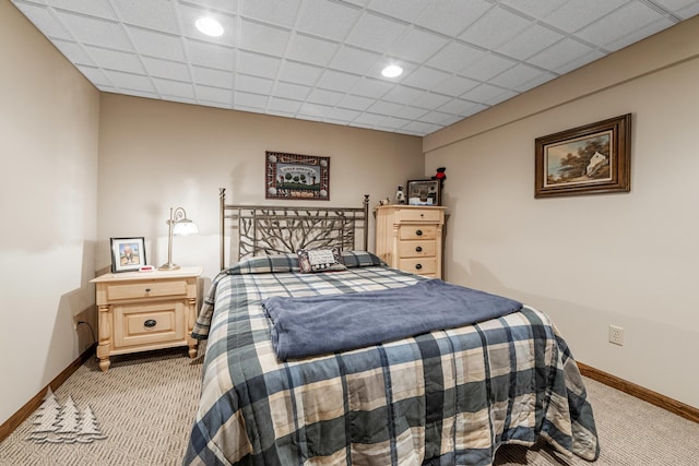 carpeted bedroom featuring recessed lighting, a paneled ceiling, and baseboards