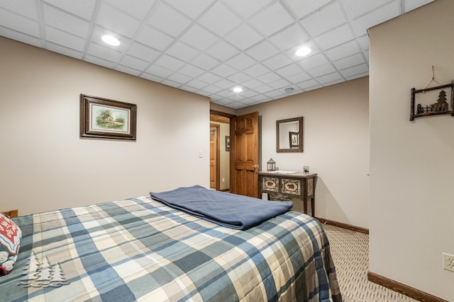 bedroom featuring a paneled ceiling, baseboards, carpet floors, and recessed lighting